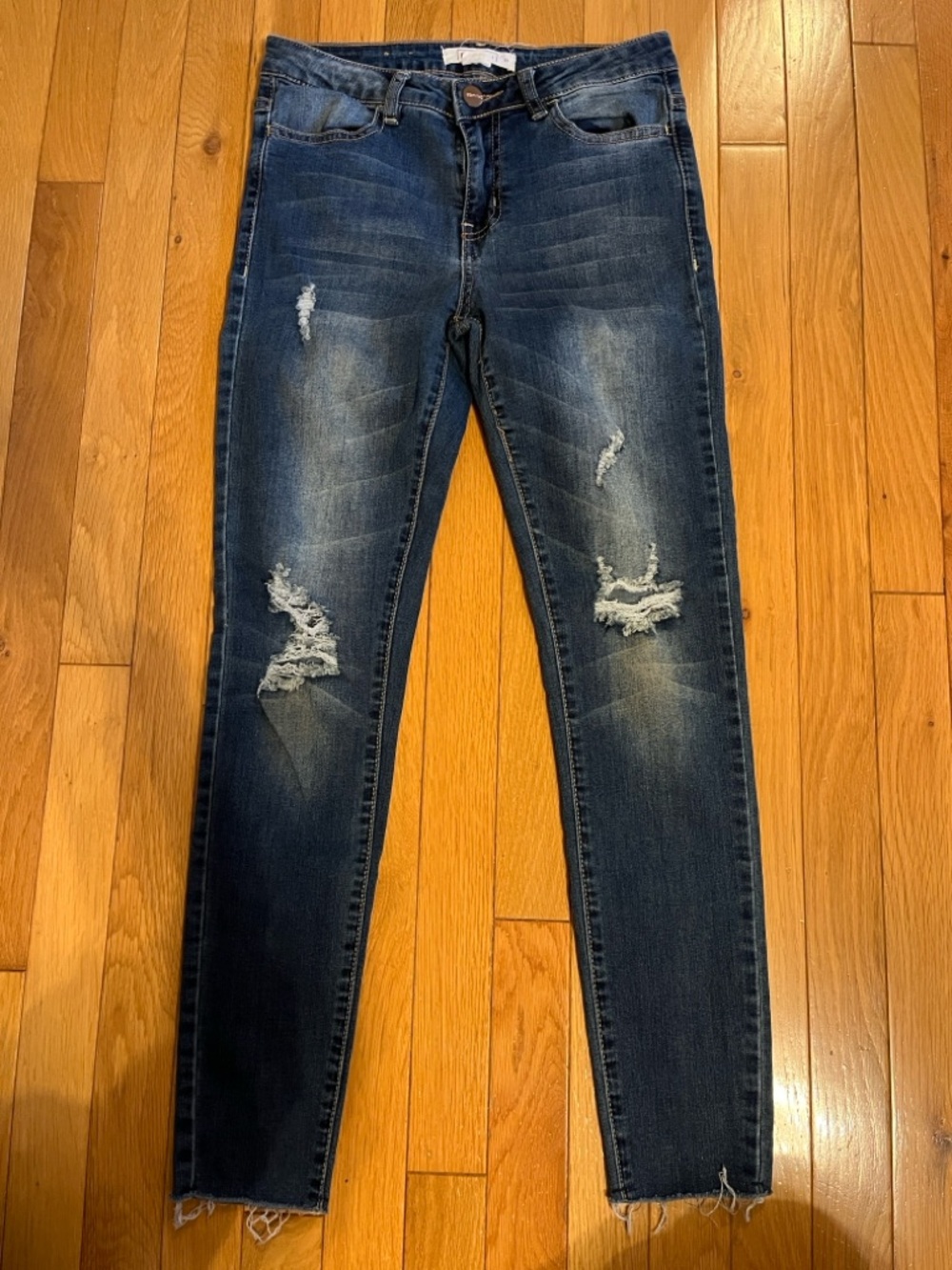 Dark wash ripped skinny jeans